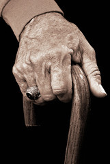 Older-persons-hand-holding-a-cane