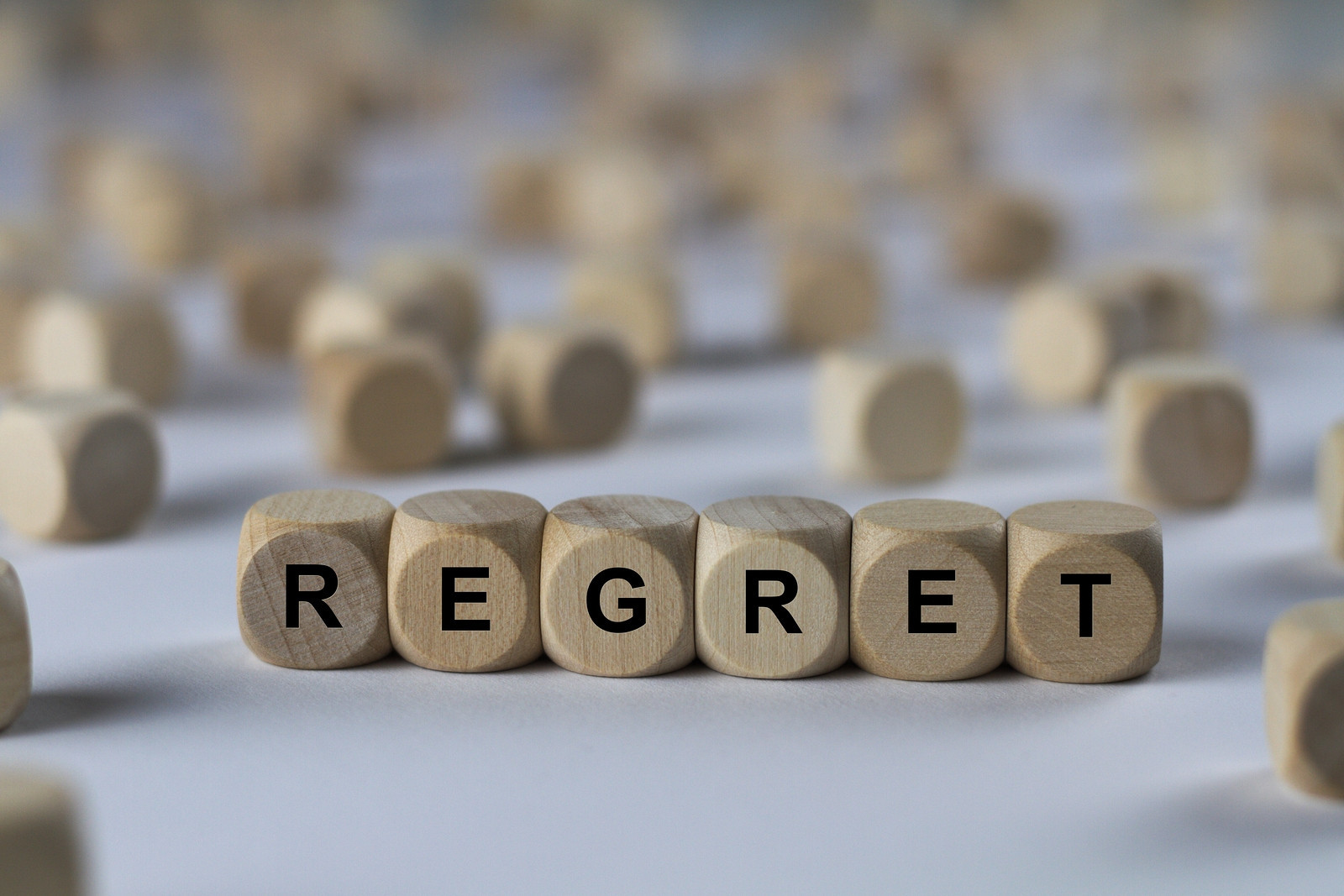 bigstock-Regret-Cube-With-Letters-Si-194070040