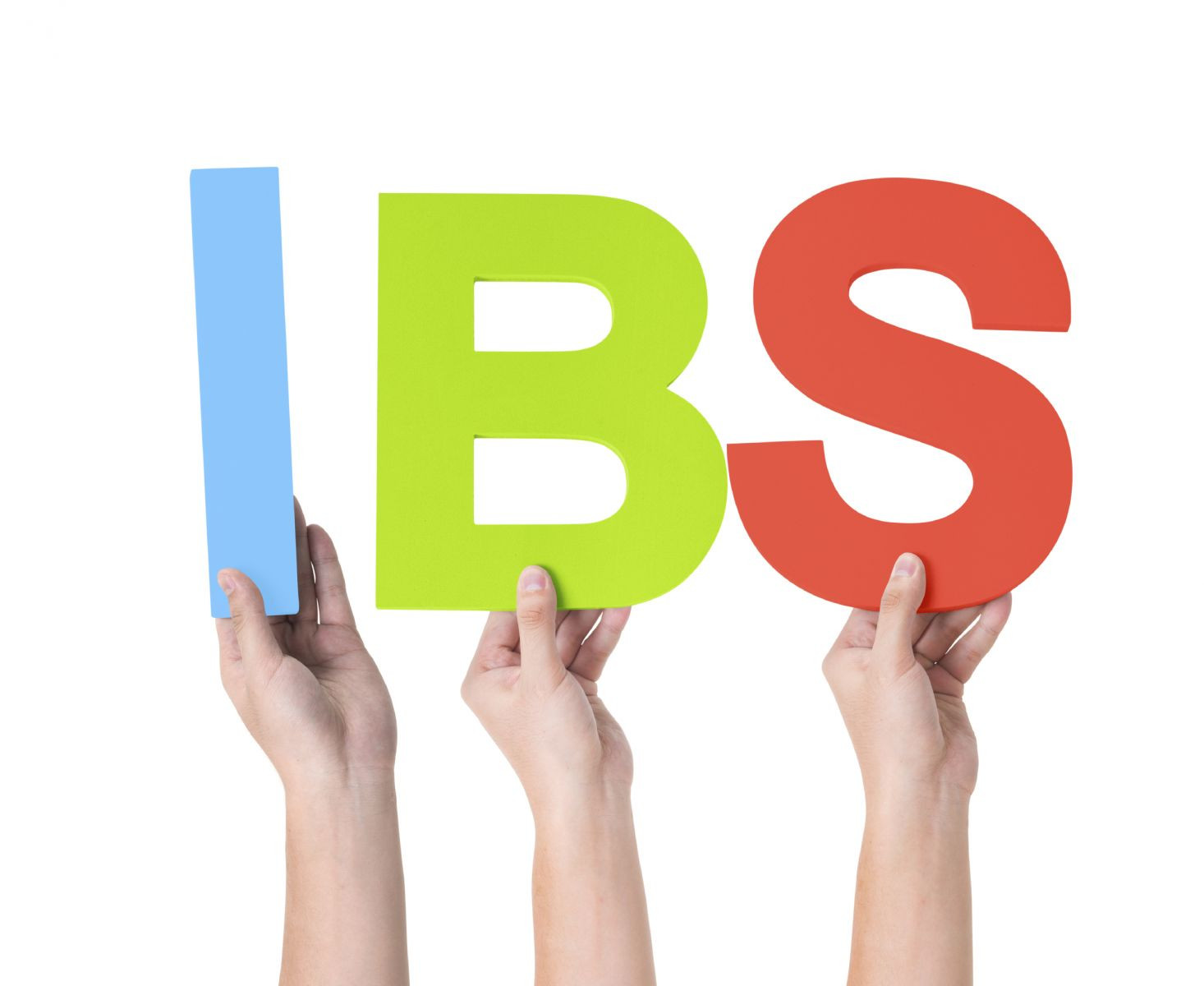 Three hands holding up letters to spell "IBS."