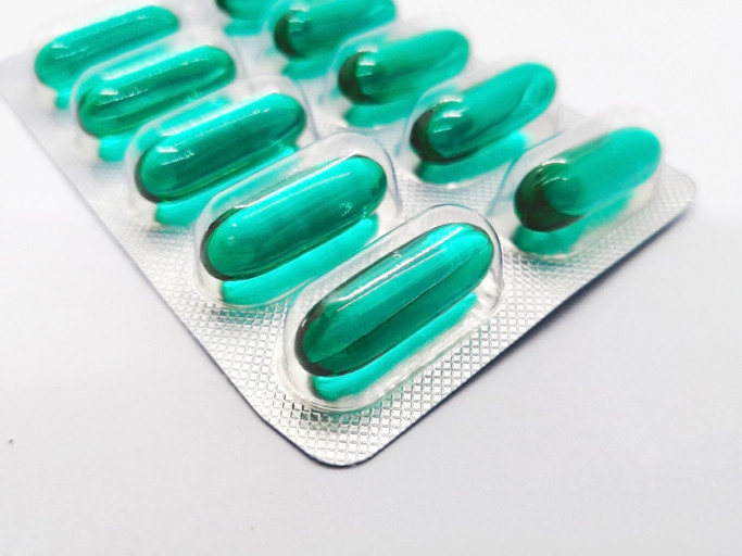 Many green capsules of fast acting Ibuprofen 400 mg.