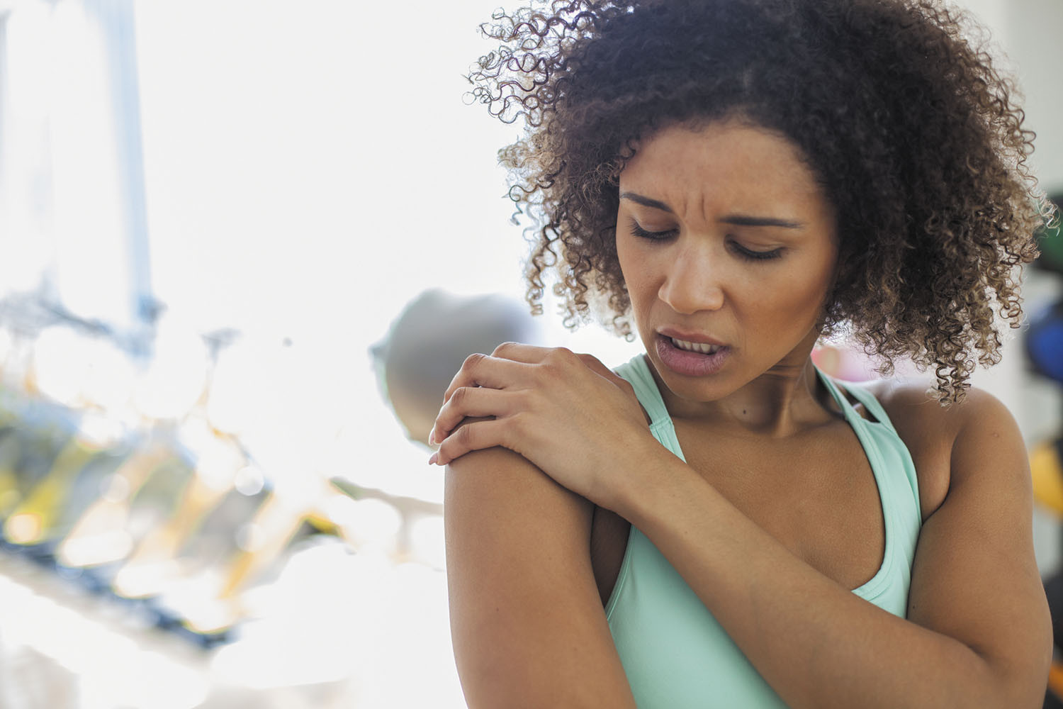 Woman at the Gym Experiencing Pain