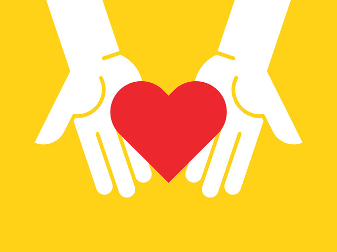 A red heart resting on two hands against a sunny yellow background