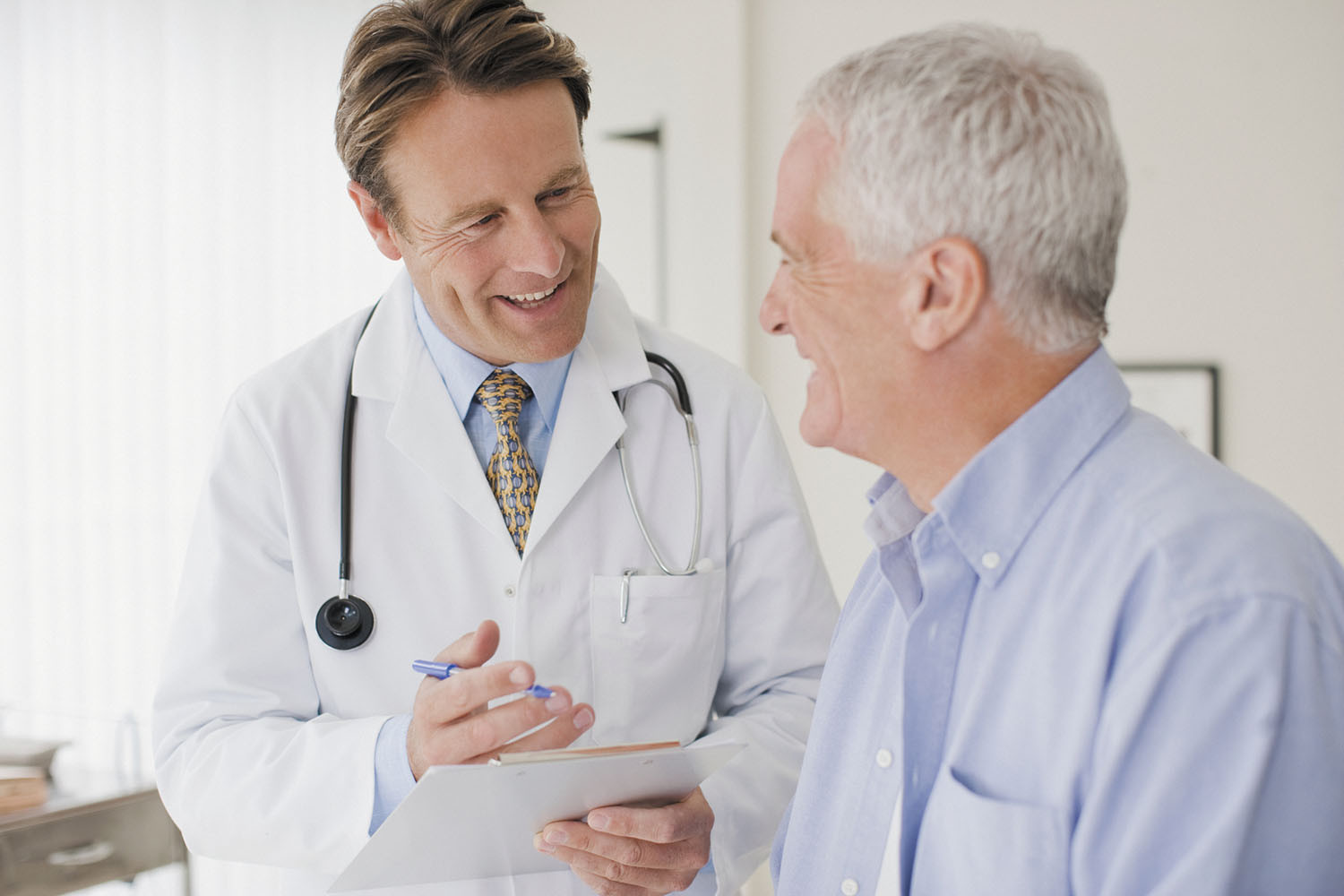 photo of doctor and patient having a conversation during a wellness visit