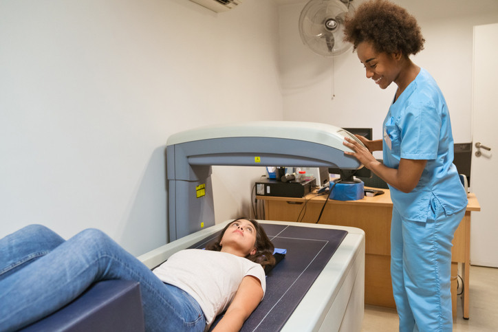 Doctor Shows The Process Of Scanning A Patient Stock Photo