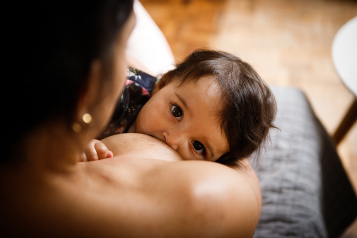 A mother breastfeeding her baby