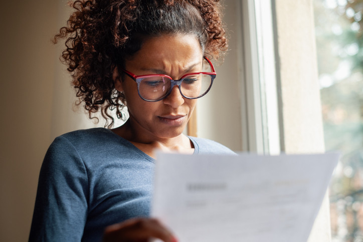 Photo of woman upset about medical bill