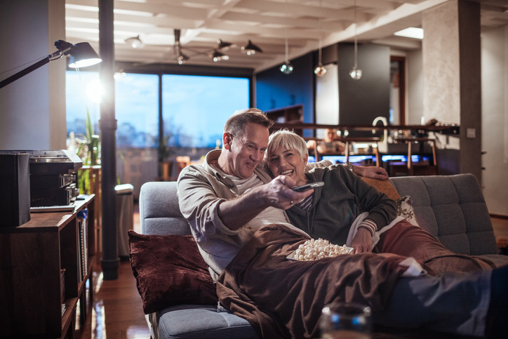 couple on couch watching tv