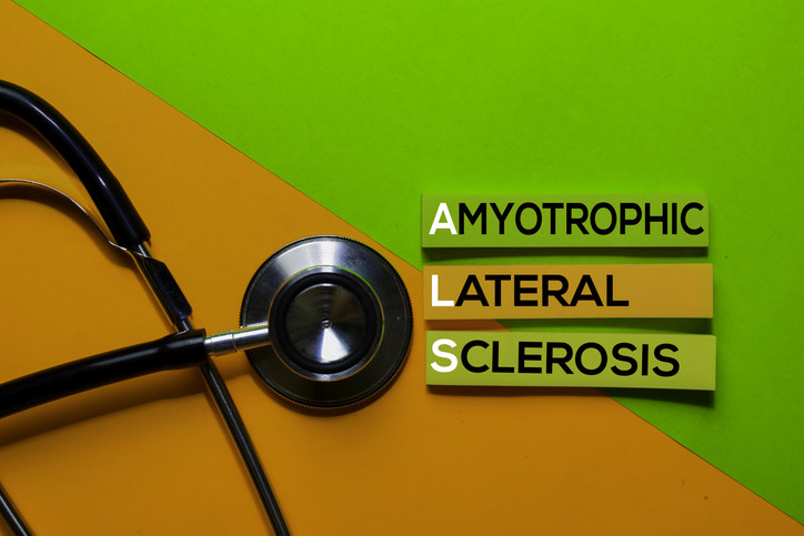 ALS, Amyotrophic Lateral Sclerosis acronym spelled out on sticky notes with stethoscope next to it.