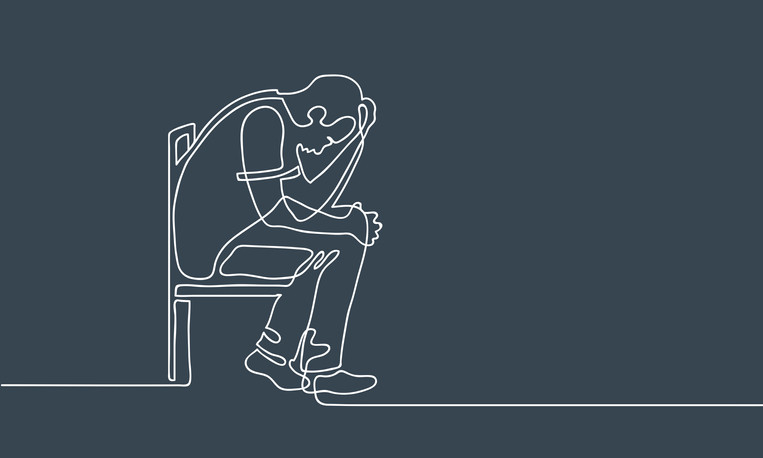 A continuous line drawing of a depressed man sitting in a chair, head in hand, against a dark gray background