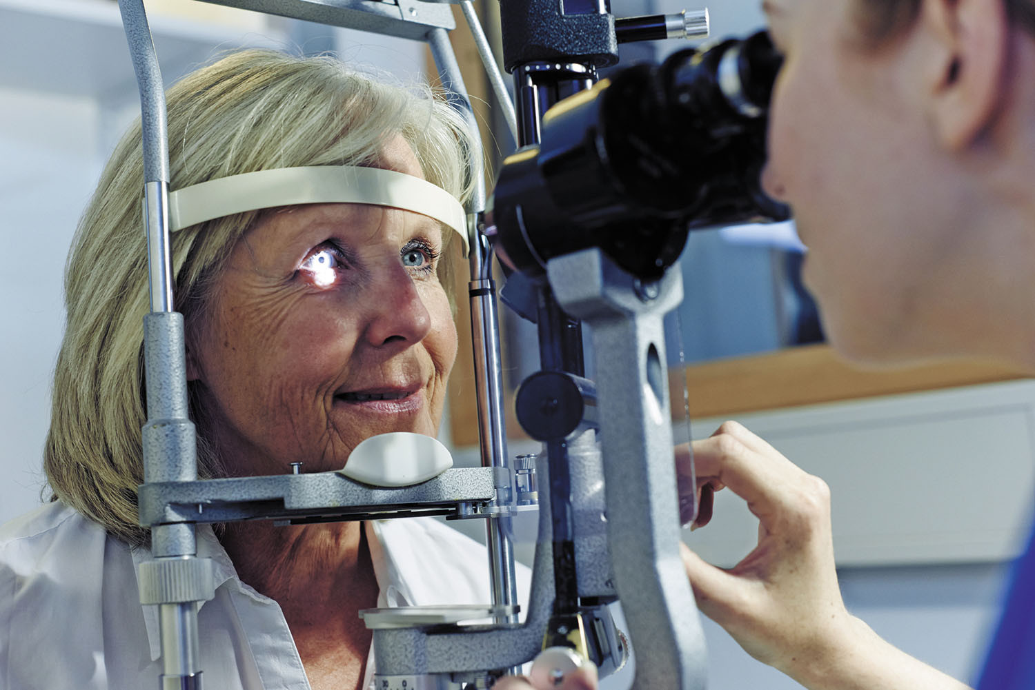photo of a woman having an eye exam