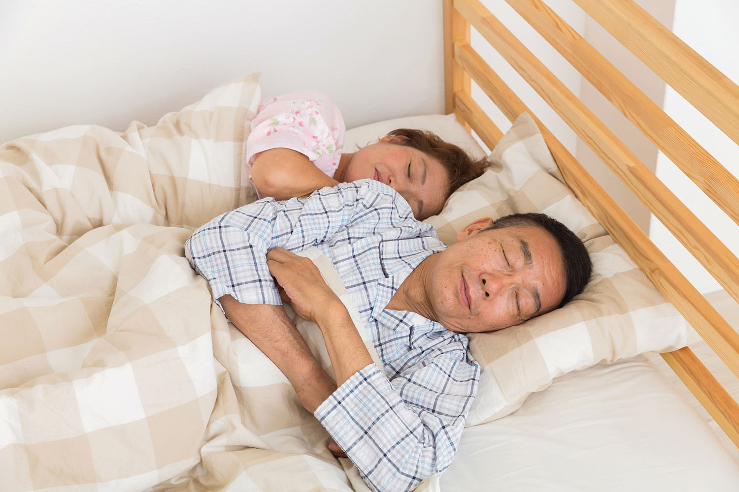 photo of a couple sleeping side by side