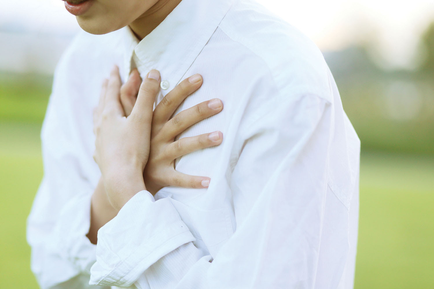 photo of a younger person clutching their chest