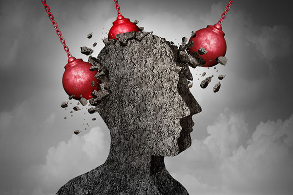 illustration of a human head made of stone, viewed from the side with three red wrecking balls smashing into it from different directions, representing the concept of headache pain