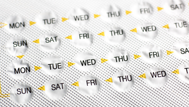 photo of a silver blister pack of birth control pills with the four rows of days of the week