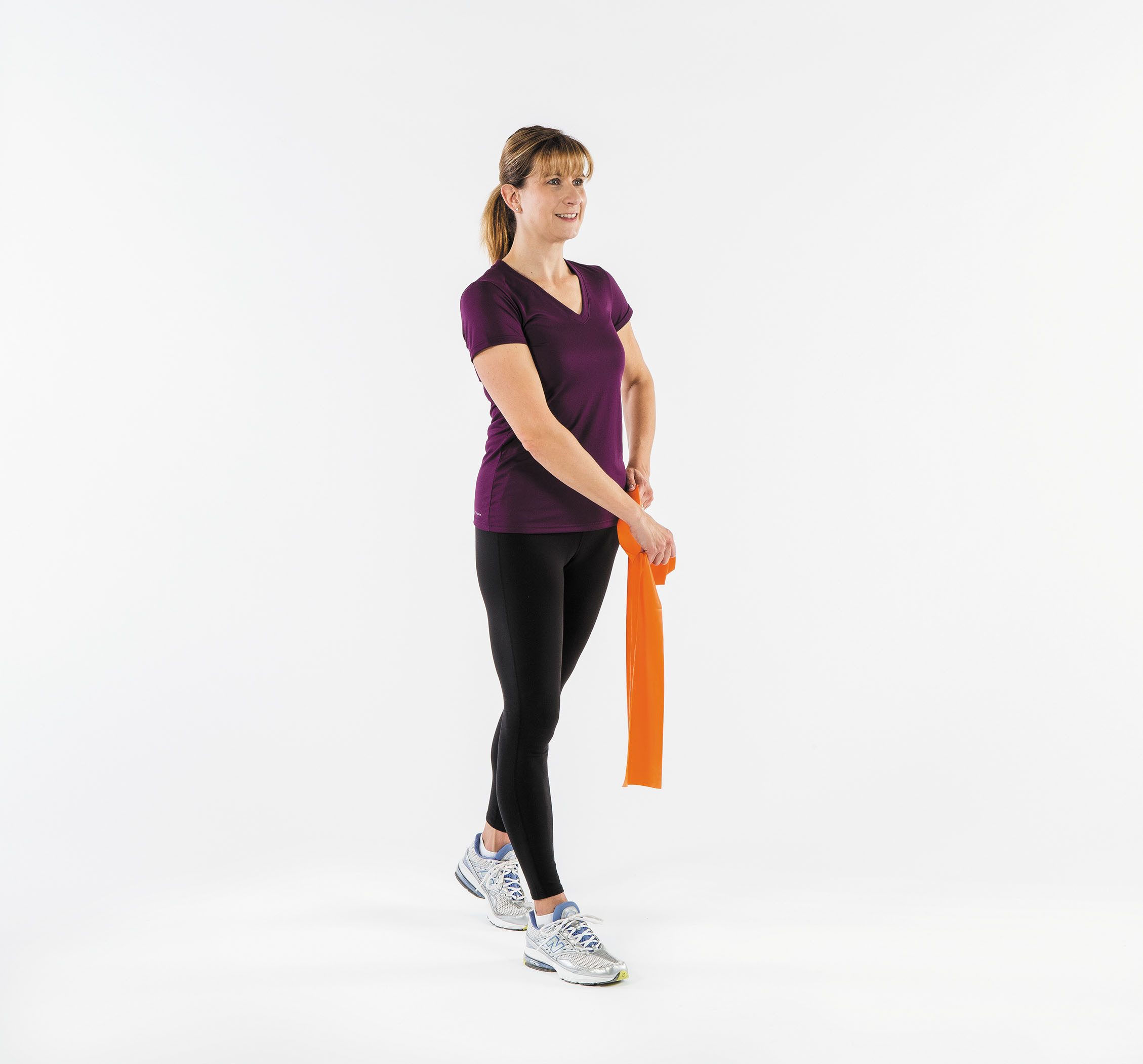 photo of a woman performing step one of the sword pull exercise