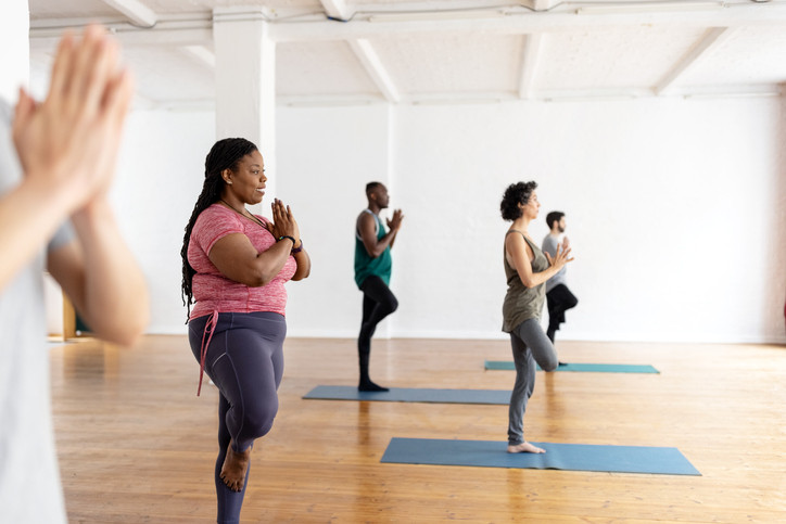 photo of a group of people in a yoga class