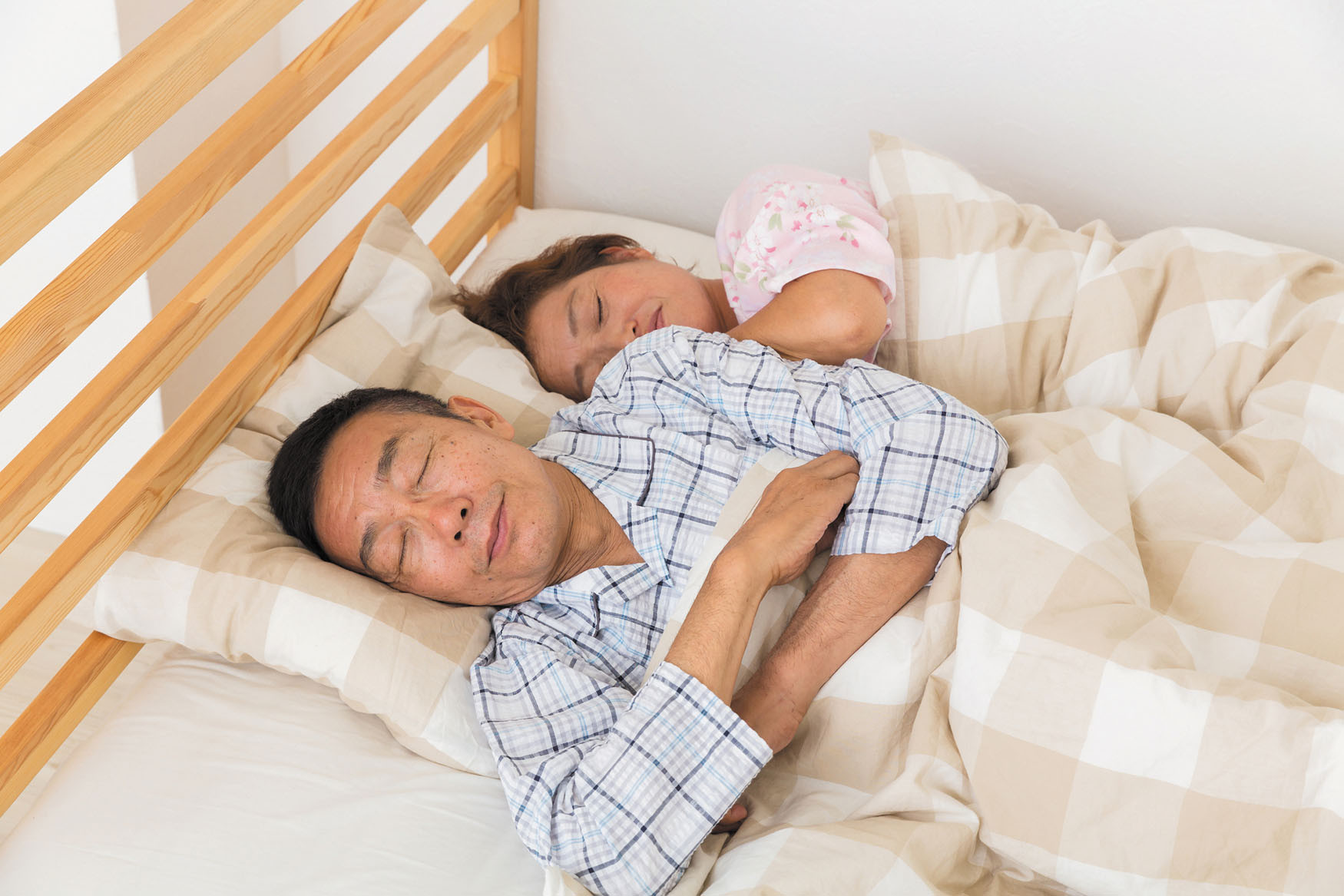 photo of a man and woman sleeping