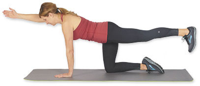 photo of a woman performing step two of the opposite arm and leg raise exercise as described in the text