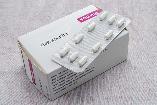 photo of a box of generic gabapentin pills, with a full blister pack containing 10 pills resting on top