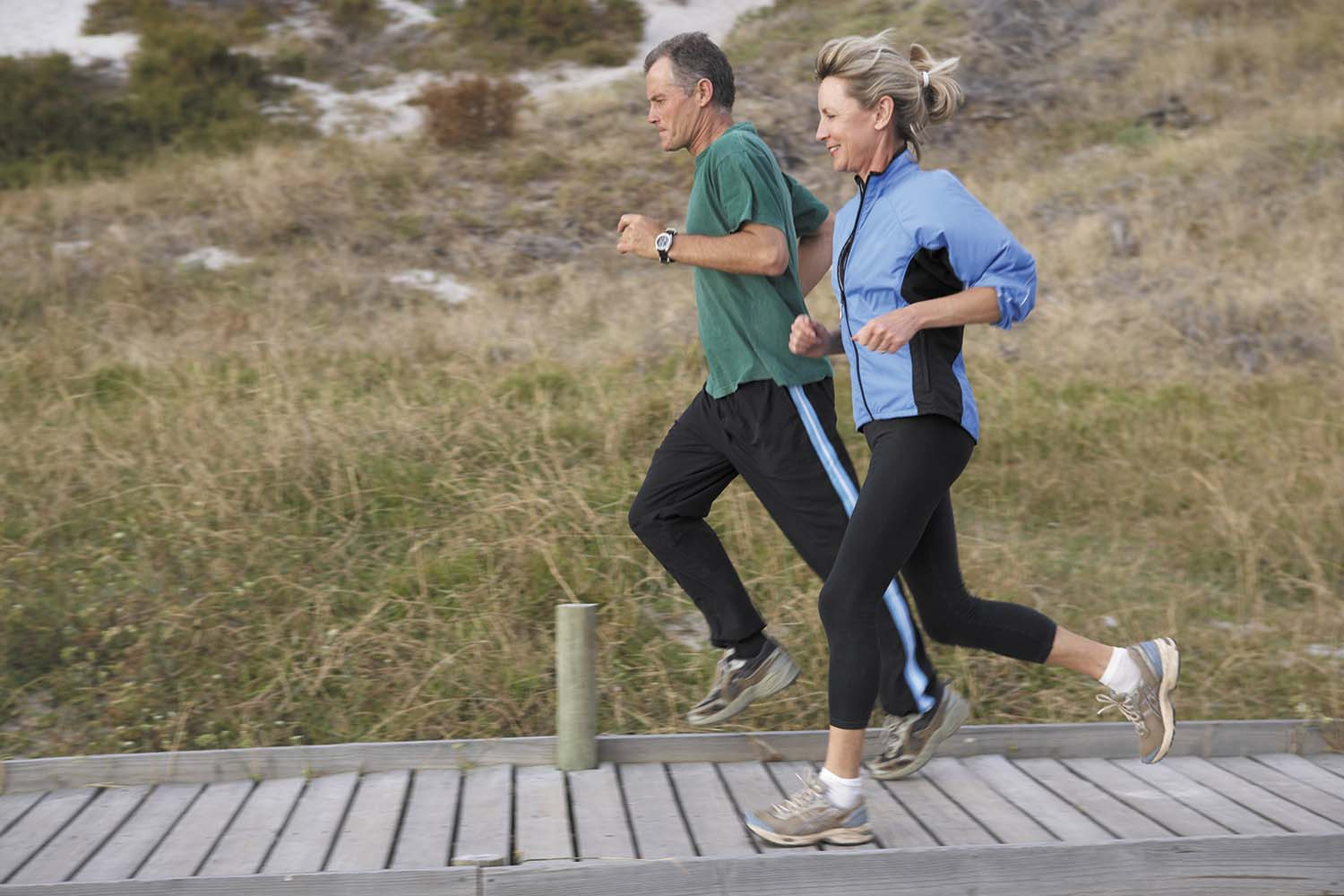 photo of a mature couple jogging together