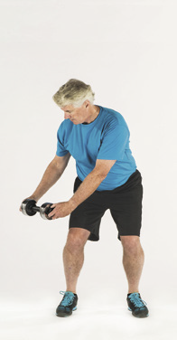 photo of a man in the starting position for the wood chop exercise as described in the article