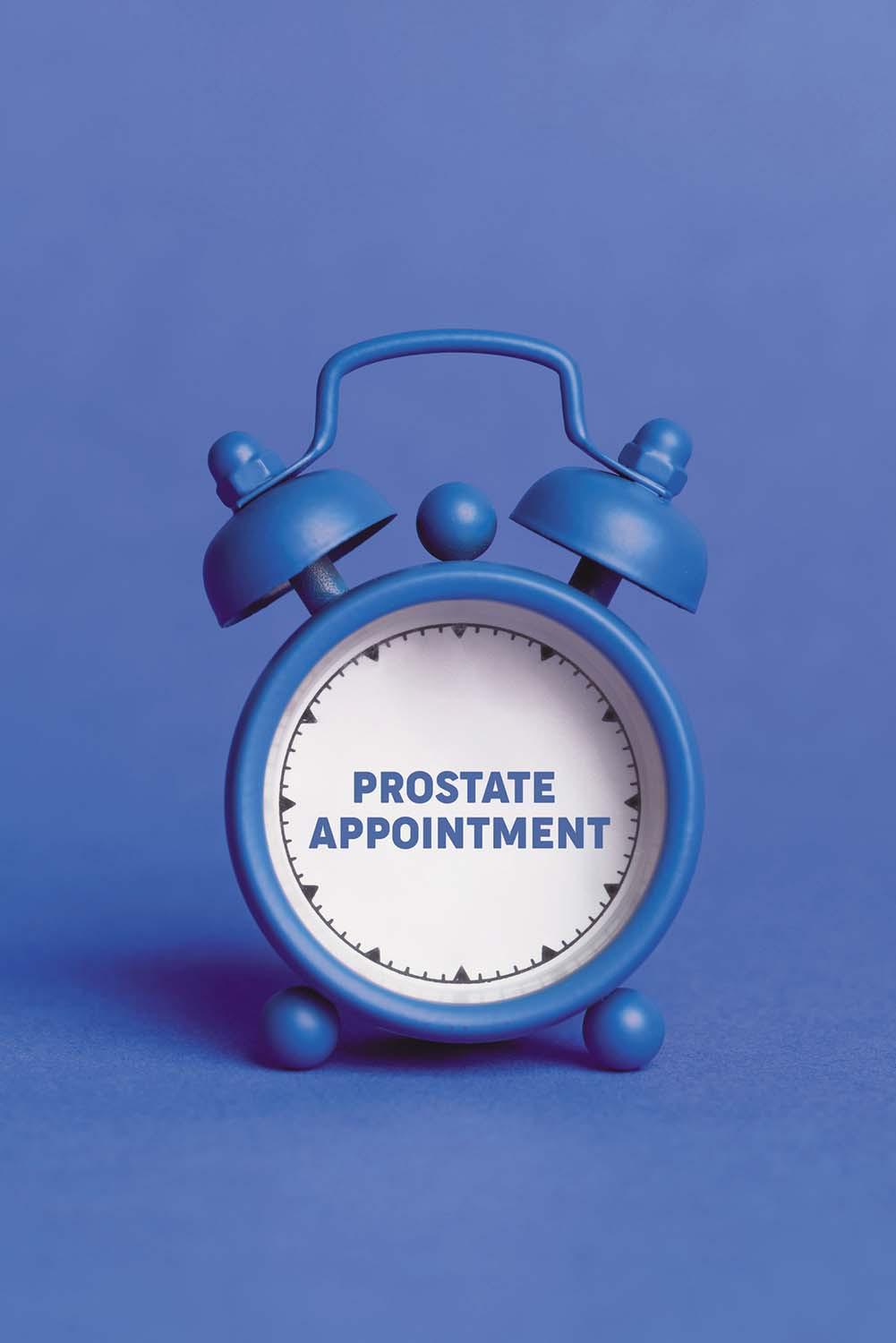 photo of a blue alarm clock against a blue background, on the clock's white face are the words prostate appointment