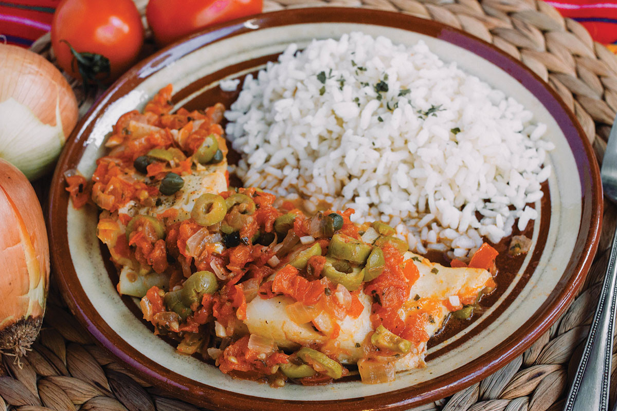 photo of a Latin American dish of fish, vegetables, and rice