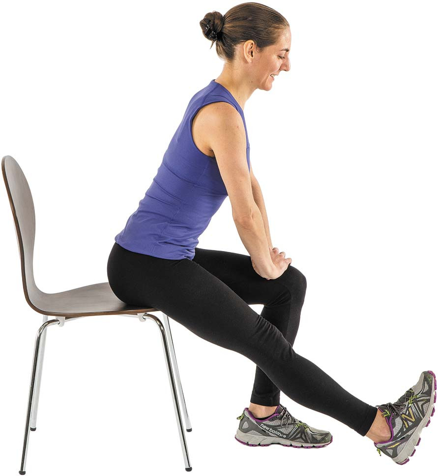 photo of a woman doing the seated hamstring exercise as described in the article