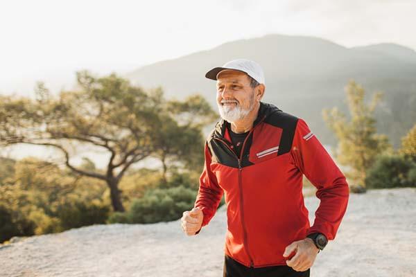 photo of a healthy senior man jogging for fitness